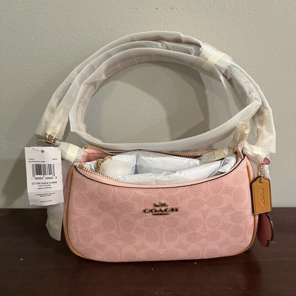 Coach Blush Pink Signature Mini Shoulder Bag with Gold Hardware.